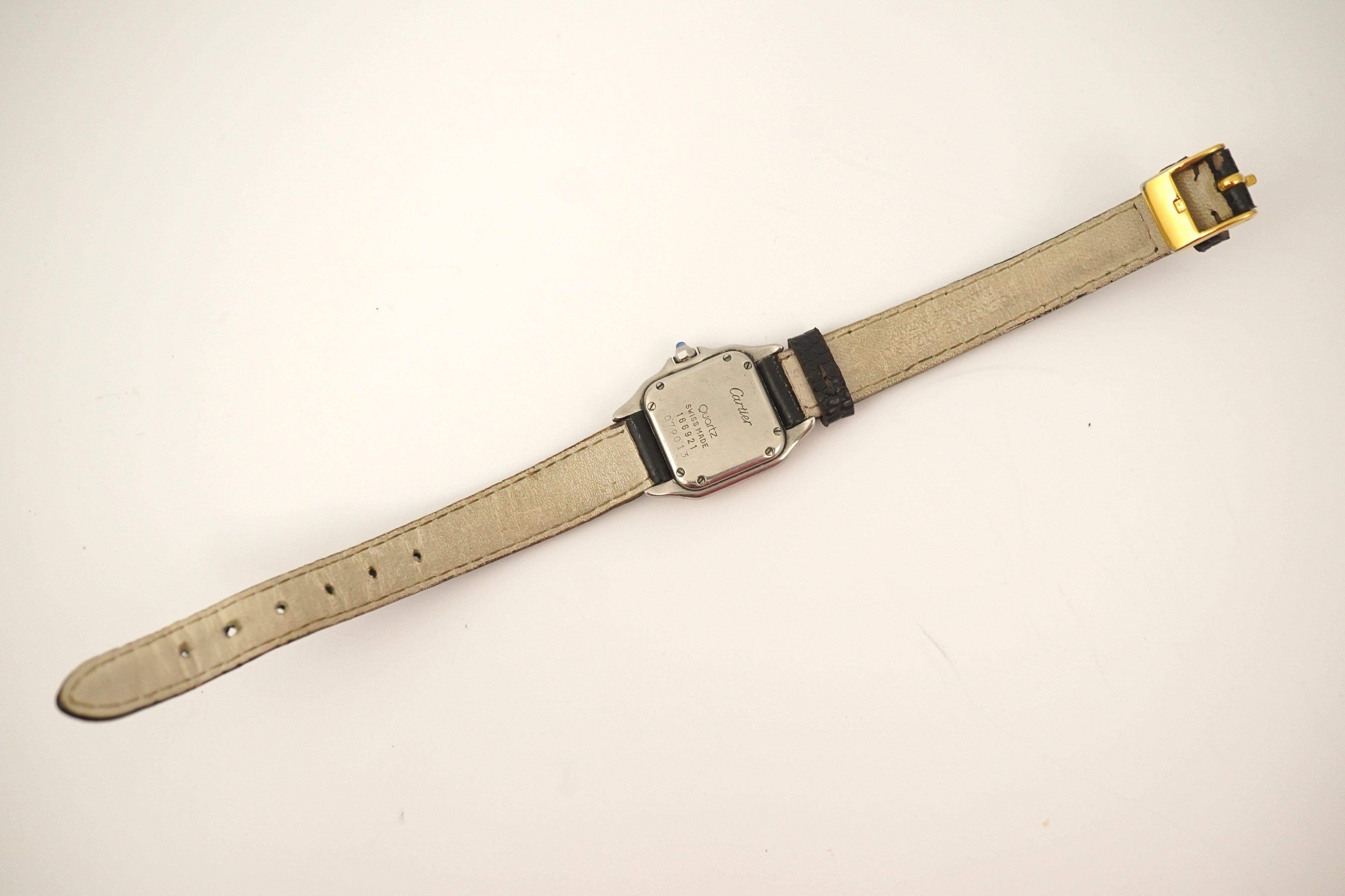 A lady's steel and gold Cartier Panthere quartz wrist watch, now on an associated leather strap, but with original Cartier steel and gold bracelet (lacking end bars)